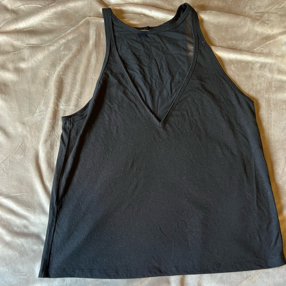Victoria’s Secret top. Size M. Black. Gently used. Mesh detail on front